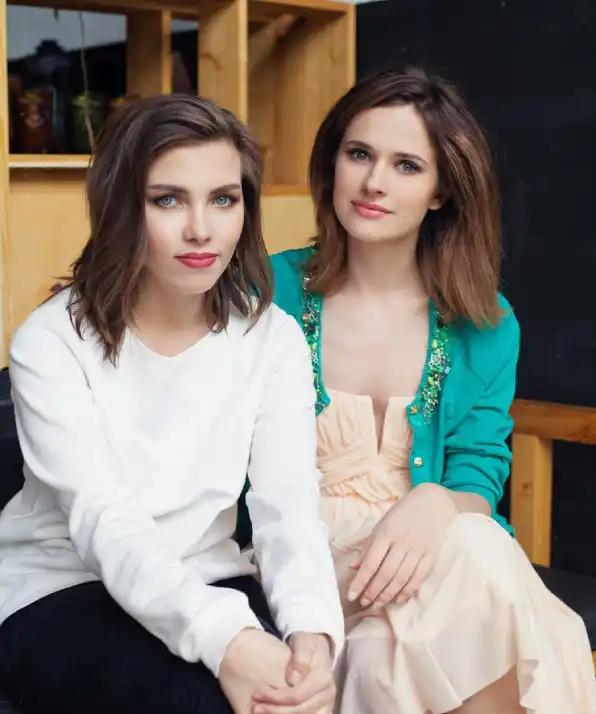 happy young women sitting indoor lifestyle portrait happy young women sitting indoor lifestyle portrait